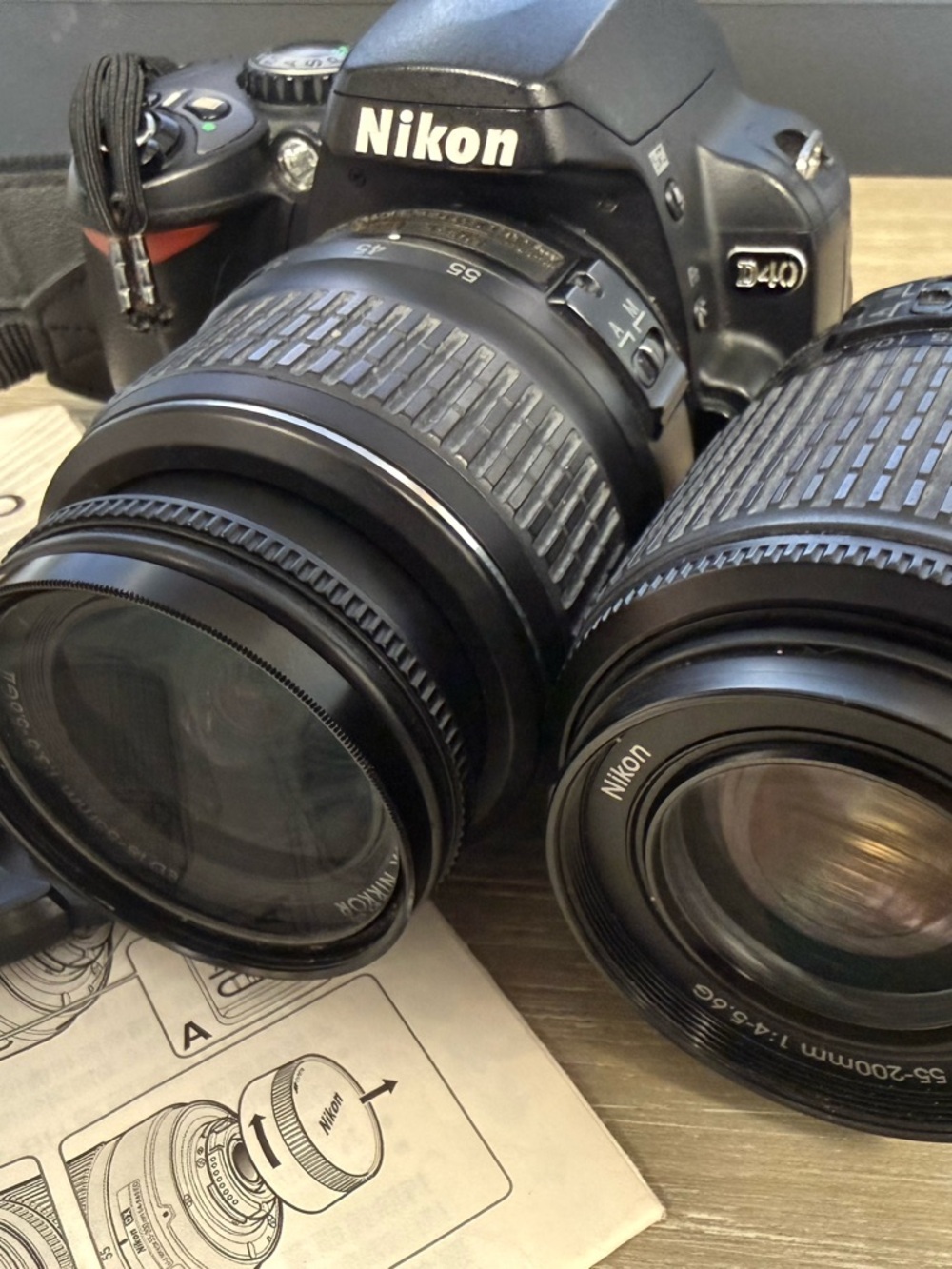 Nikon Black DSLR Camera Body with Two Black Zoom Lenses